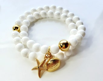 White shell wrap bracelet with gold seashore charms