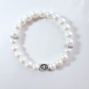 Virgin Mary bracelet with pearlescent white crystal pearls, sterling silver rhinestone beads and antique silver Virgin Mary charm.