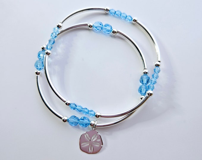 Truly Blessed, so many blessings bracelet duo with Austrian crystal aqua beads and silver Sand dollar charm.