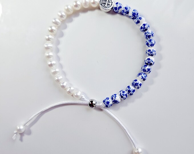 ST. BENEDICT bracelet the patron saint of protection made with white freshwater pearls, blue floral beads and St. Benedict charm.