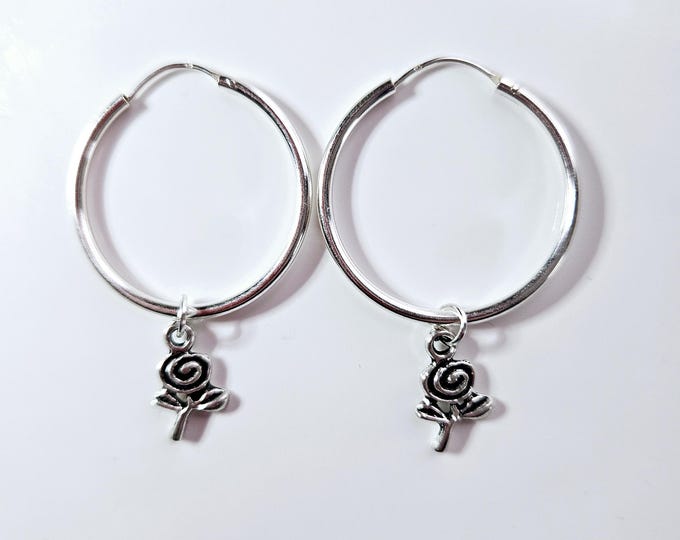 Sterling silver 1.0-inch endless hoop earring with wire and silver rose charm.