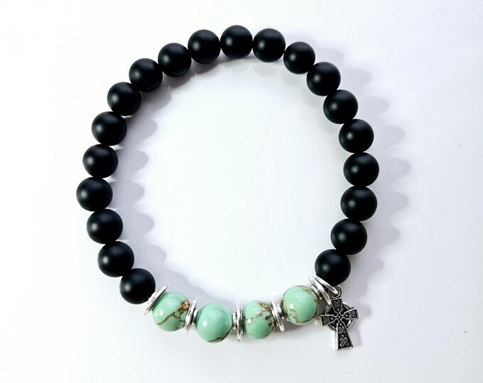 Black onyx and gold turquoise magnesite bead bracelet with Celtic cross charm.