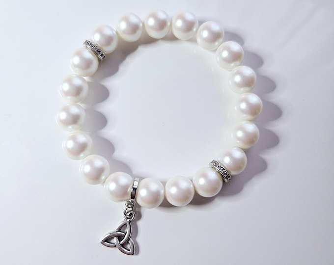 Frienship knot/trinity knot bracelet with Austrian crystal pearlescent white pearl beads and silver trinity knot charm.