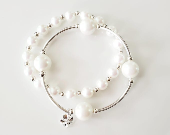 Pearlescent White Crystal Pearl Bracelet: Sterling Silver Plumeria Charm