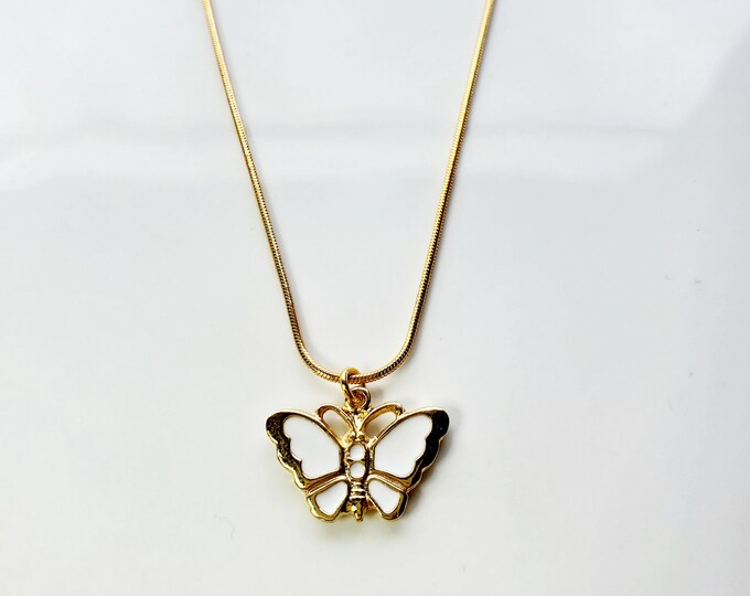 Gold plated white enamel butterfly necklace on gold plated snake chain