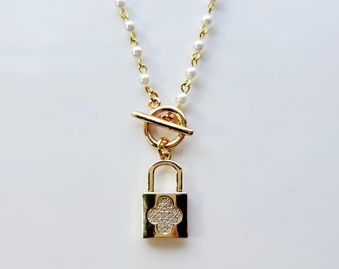 White pearl rosary bead chain with four leaf clover padlock charm