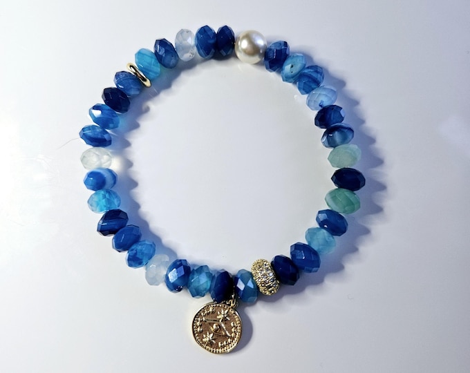 Beautiful blue gemstone Candy bracelet with 14kt gold filled evil eye charm.