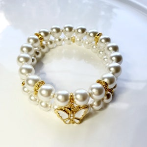 White Preciosa pearl bracelet set with gold plated white enamel butterfly charm