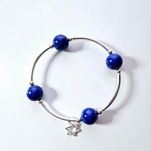 Truly blessed bracelet with blue lapis beads and silver Star of David charm.