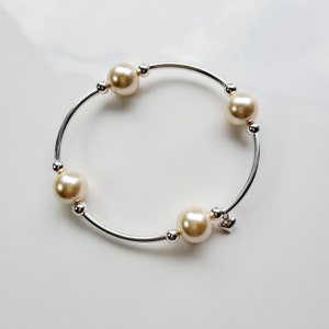 Gouden parel sterlingzilveren zegenarmband met hartbedel