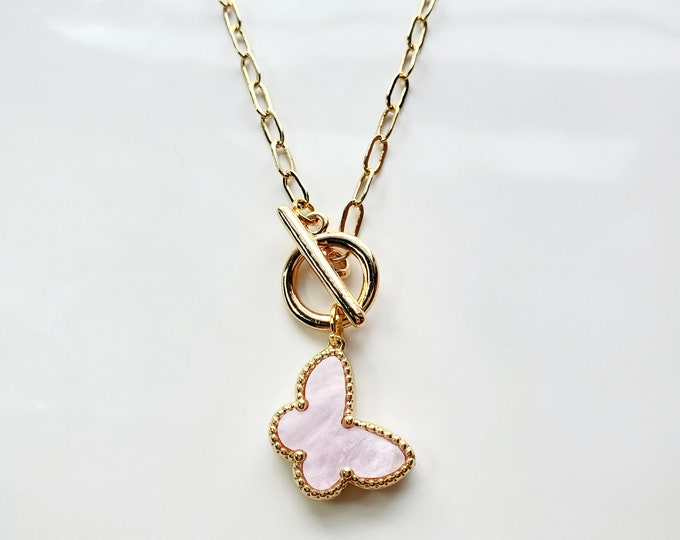 Butterfly charm necklace with soft pink Mother of pearl butterfly charm on gold plate paperclip chain.