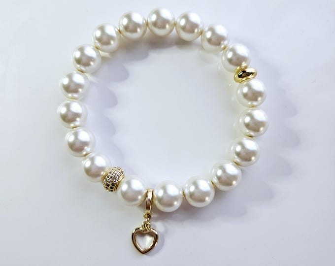 Open heart charm bracelet with Austrian crystal white pearls and 18kt gold open heart charm.