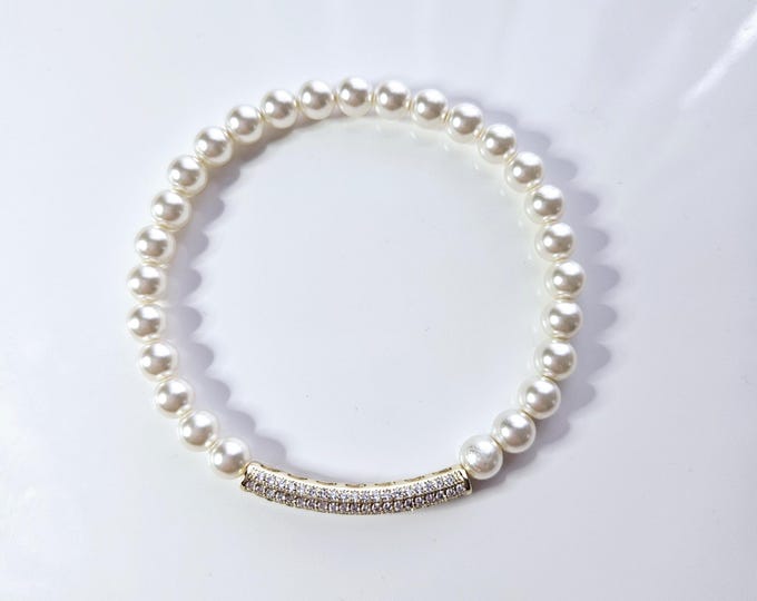 Austrian crystal white pearl bracelet with gold rhinestone tube bead.