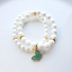 White pearlized Preciosa pearl bracelet set with mint green Mother of pearl butterfly charm