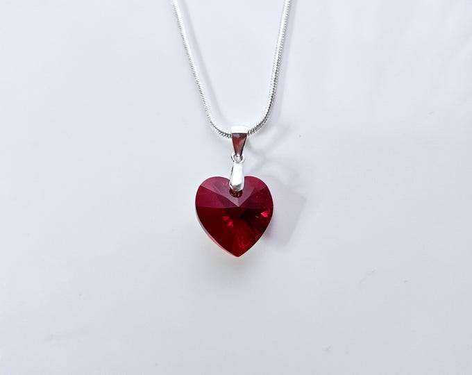 Sterling silver Austrian crystal ruby AB heart pendant on silver snake chain.