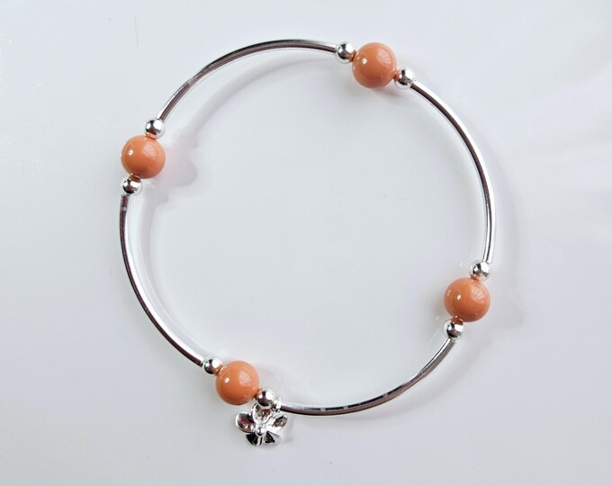 Coral pearl 'count your blessings" bracelet with sterling silver beads and sterling silver flower charm