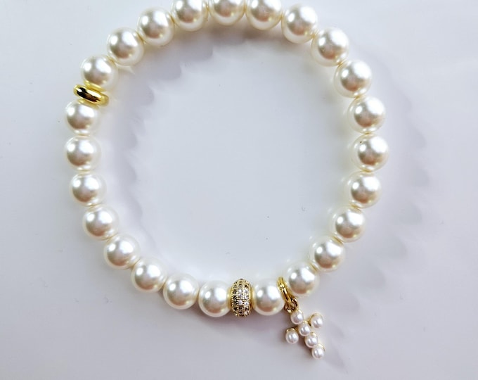 White pearl bracelet with 14kt gold filled white pearl cross charm.
