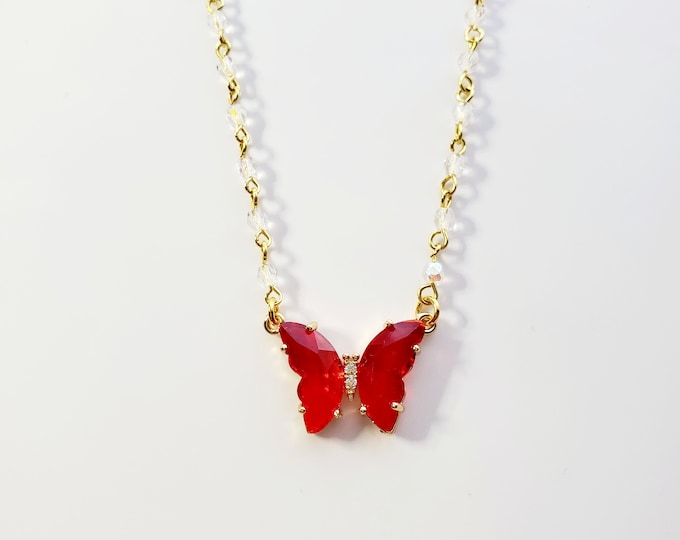 Ruby butterfly necklace on pearl rosary bead chain
