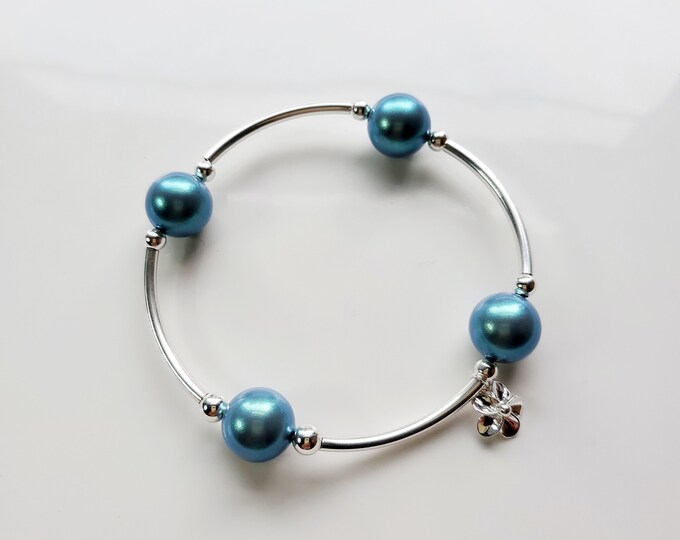 Truly Blessed, count your blessings bracelet with Austrian crystal pearlescent blue pearls, sterling silver beads and flower charm.