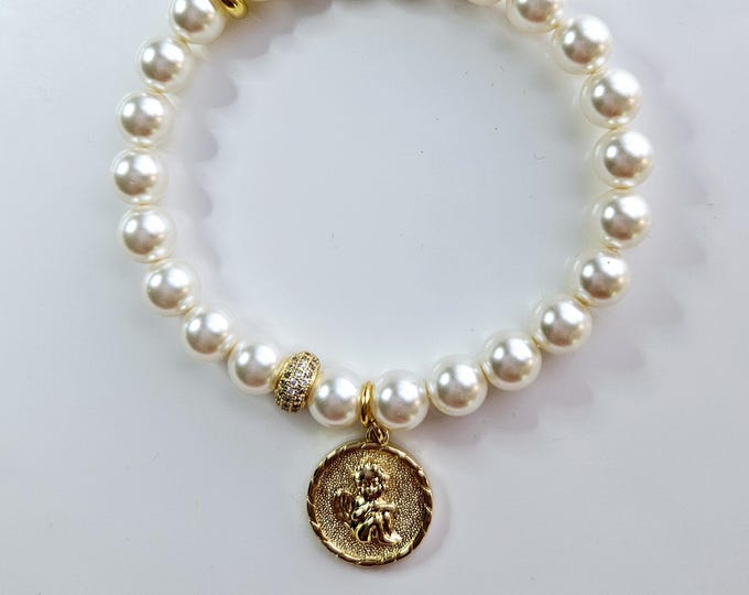 White pearl bracelet with 14kt gold filled cherub angel charm.