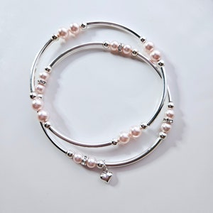 Truly Blessed, so Many Blessings armbandduo met Oostenrijkse kristallen rosaline parelkralen en zilveren hartbedel