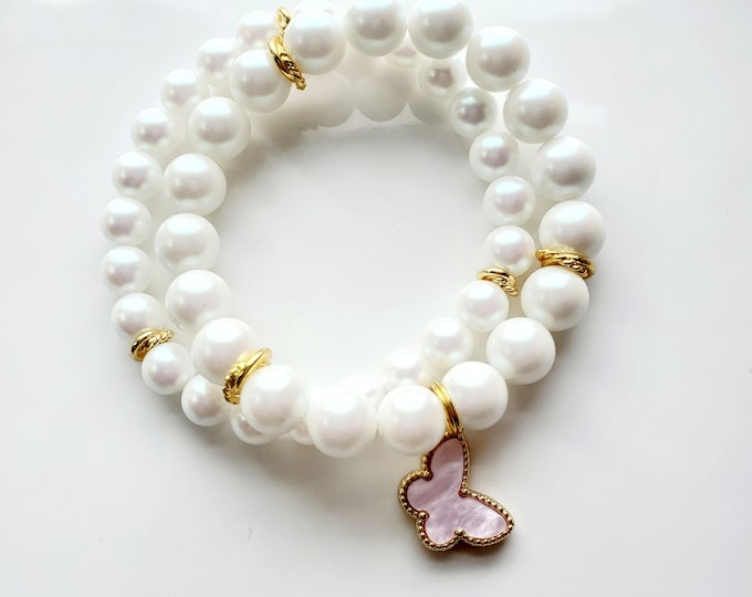 White pearlized Preciosa pearl bracelet set with soft pink Mother of pearl butterfly charm.