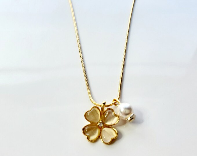 Peach 4 leaf clover necklace with pearl dangle on gold plated snake chain