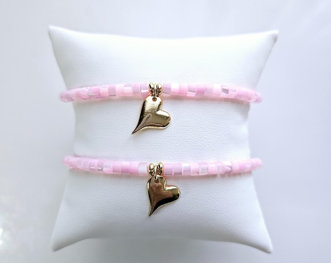 Mother daughter bracelet with soft pink mother of pearl heishi beads and 14kt gold filled heart charm.