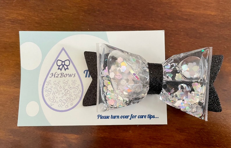 Silver and Black Holographic Sparkly-Worlds 1st H2BOW Water Filled Glitter Shaker Hair BowClip-
