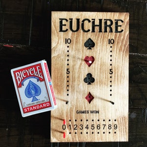 Euchre Scoreboard with cards and pegs