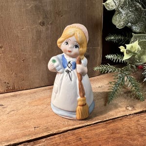 Jasco Merri-Bells Fine Bisque Porcelain Girl Holding Broom Figurine; c. 1978