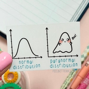 May include: A white card with two graphs, one labeled "normal distribution" with a bell curve and the other labeled "paranormal distribution" with a ghost-shaped curve. The ghost has a happy face and says "Boo!"