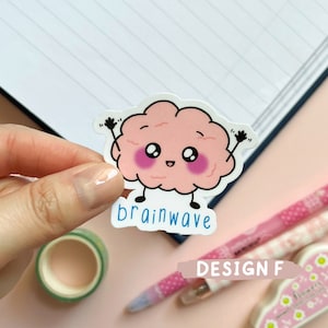 May include: A pink brain with a smiling face and big eyes, with the text "brainwave" below it. The sticker is on a white background.