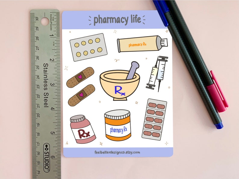 May include: A sticker sheet with a light blue background and the text "pharmacy life" in black. The sheet features various pharmacy-themed illustrations, including pills, bandages, a mortar and pestle, a syringe, and a tube of ointment.
