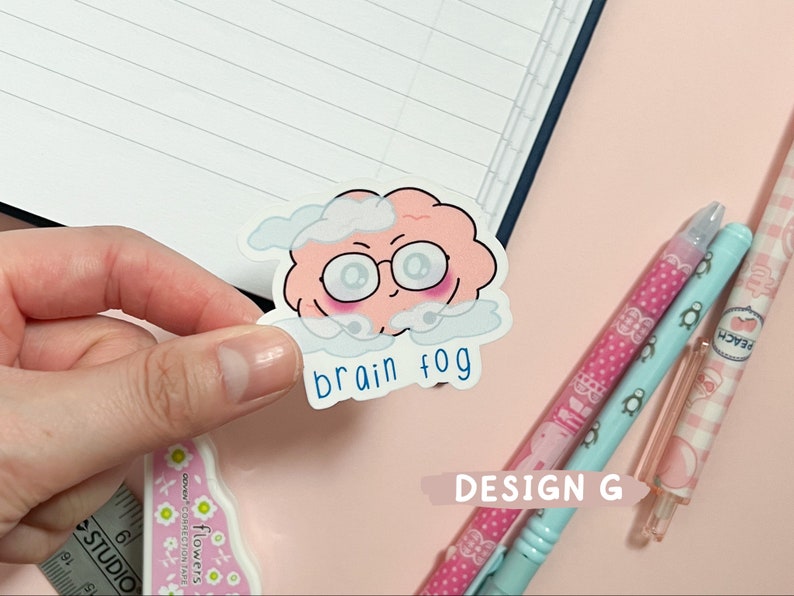 May include: A pink brain with eyes and a cloud around it. The text "brain fog" is written below the brain.