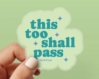 May include: A light green sticker with the text "this too shall pass" in teal, surrounded by a cloud-like shape. The sticker also features small blue star accents and the text "LarkType".