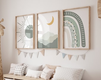 May include: A children's room featuring three framed art prints with a sun, moon, and rainbow design in neutral tones. A woven giraffe and storage bench with white bins and pillows complete the decor. A garland of small flags hangs below the art.