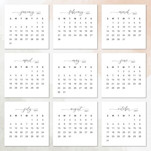 May include: A set of nine white square calendar pages for the year 2027, featuring months from January to October. Each page displays the month name in a black cursive script, the year 2027, and a grid of dates with black sans-serif numerals.