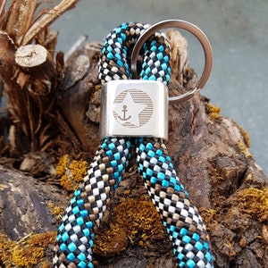 Key ring made of sailing rope / sailing rope, with a silver-plated “star anchor” connector, with a mini pendant on request