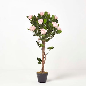 May include: An artificial rose tree in a black pot, featuring light pink roses and green foliage. The trunk is brown. The tree is a decorative item for home decor.