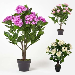 May include: Three artificial hydrangea plants in pots. The plants are in different colours: pink, white, and purple. The plants are all in black pots.