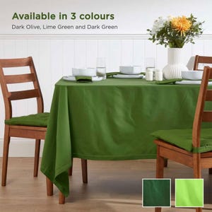 May include: A dining table set with a dark olive green tablecloth, matching chair cushions, and white tableware. The text "Available in 3 colours" is displayed above the table. The available colours are dark olive, lime green, and dark green.