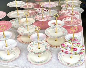 Assortment of pretty mismatched pink floral mini 3-tiered cake stands made with recycled plates