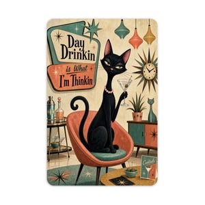 May include: A rectangular wall sign featuring a black cat sitting in a coral-colored chair, holding a martini glass. The text reads Day Drinkin is What I'm Thinkin. The background includes a starburst clock, hanging pendant lights, and a bar cart.