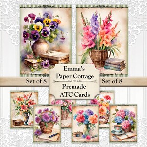May include: Set of eight premade ATC cards from Emma's Paper Cottage. The cards feature watercolor floral arrangements in vases and baskets, with books and a teacup. The cards have a vintage aesthetic with the text "Emma's Paper Cottage Premade ATC Cards".