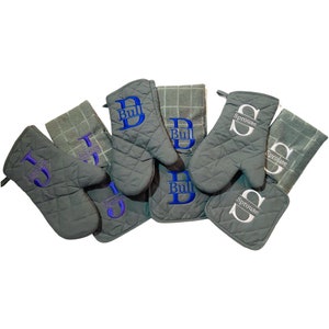 May include: Set of six gray quilted oven mitts and pot holders with embroidered names, including "Bull", "Sprouse", and "Jessic".