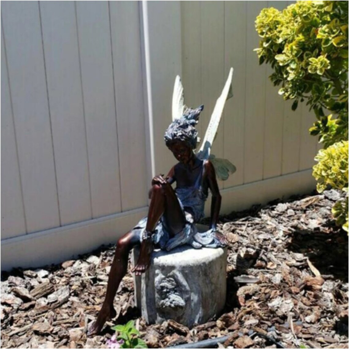 turek sitting fairy statue