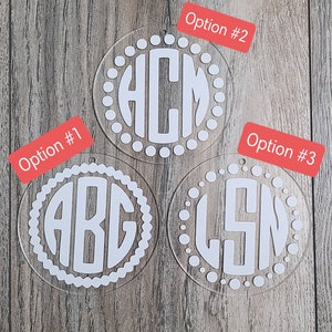 May include: Three clear acrylic ornaments with white monogram letters and a white dotted border. The ornaments are labeled "Option #1", "Option #2", and "Option #3".