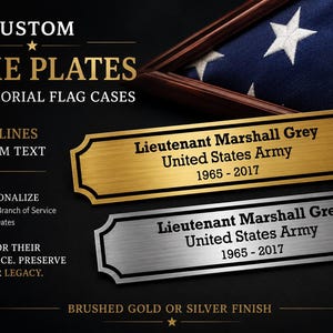 May include: Custom name plates for memorial flag cases. The image shows two name plates, one gold and one silver, with the text "Lieutenant Marshall Grey, United States Army, 1965-2017". The plates are designed to be personalized.