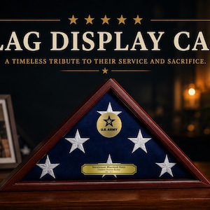 May include: A wooden flag display case with a blue interior and white star accents. The case features a gold emblem with a star and the text "U.S. ARMY". The text "FLAG DISPLAY CASE" is displayed above the case.